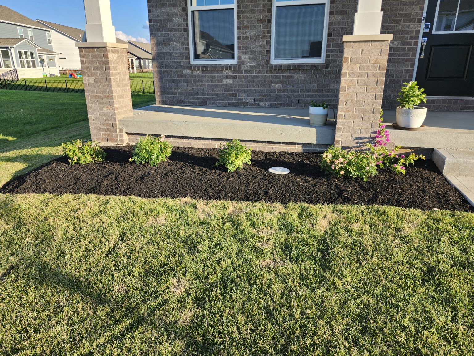 Newly mulched flower bed at front porch